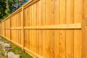 Wooden,Fence,With,Green,Lawn,And,Houses